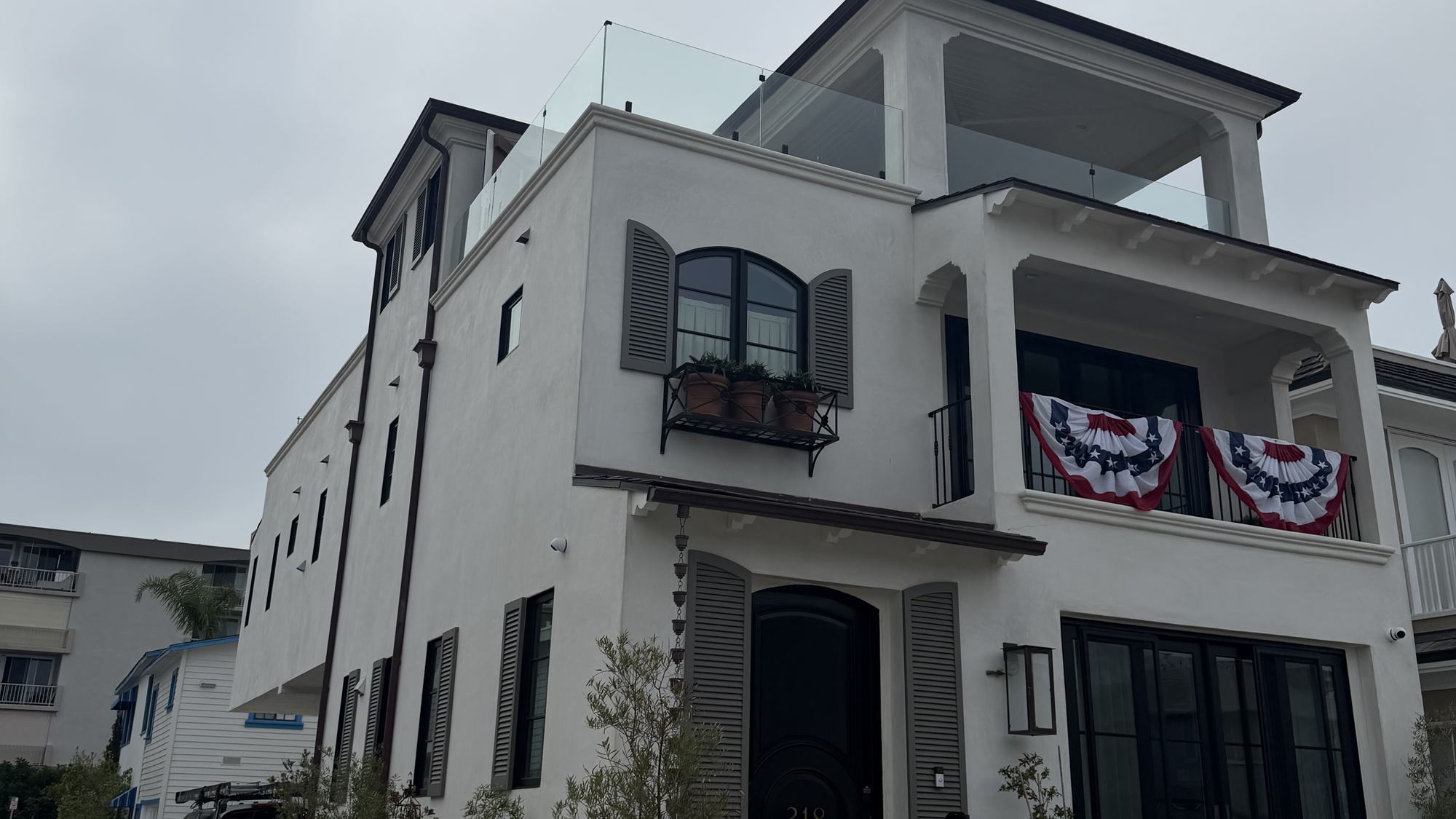 Modern home facade with black aluminum window frames